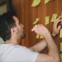 Person writing on sticky notes